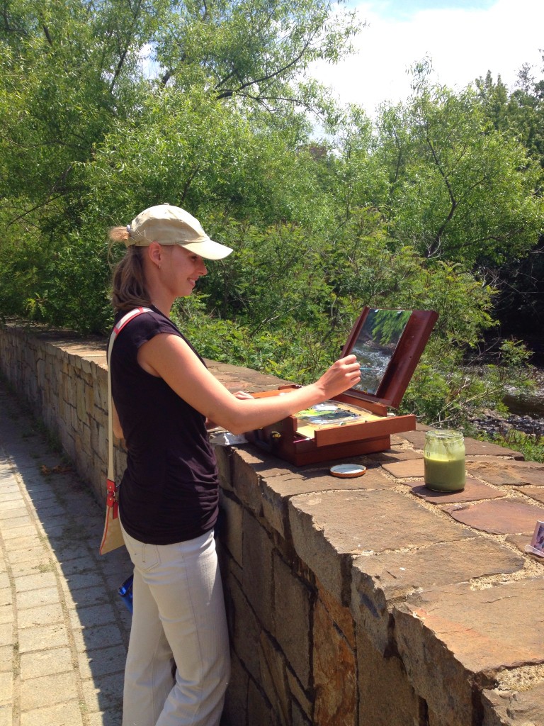 Anna painting en plein air