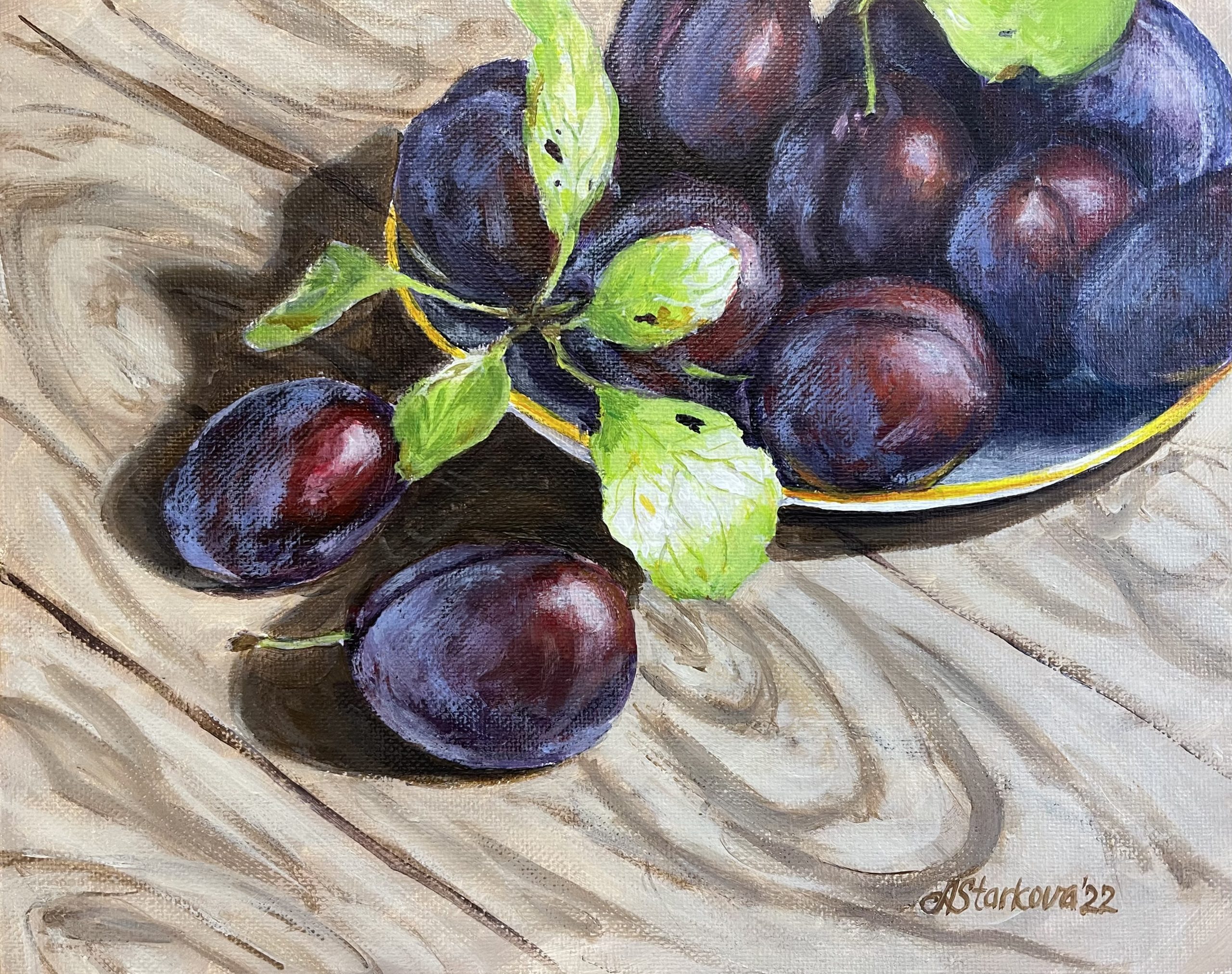 "Plums on sunny table"